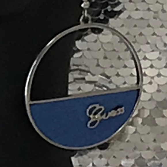 NWT Guess Silver Tone Hoop Earrings With Silver Cursive Logo On Blue Background - Picture 3 of 11
